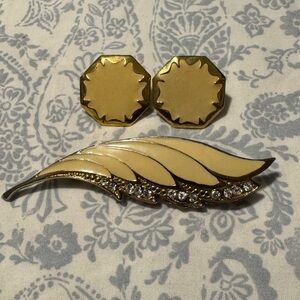 Vintage enamel, gold tone brooch and clip on earrings.